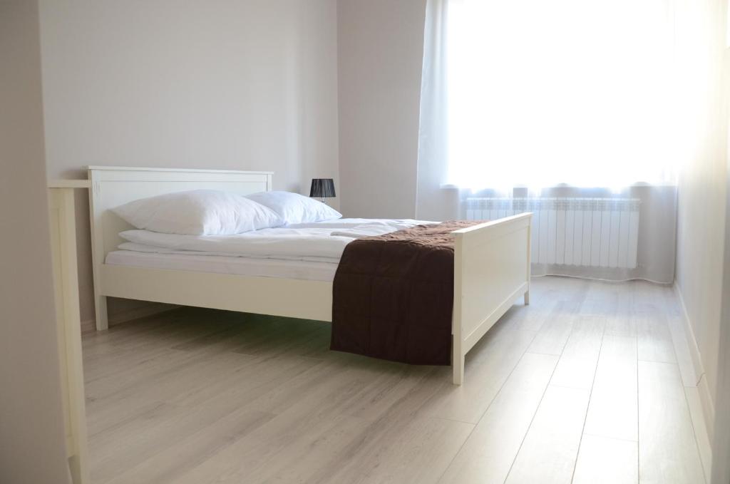 
Łóżko lub łóżka w pokoju w obiekcie Magnolia Apartment
