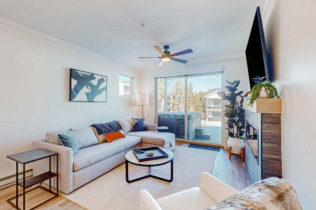a living room with a couch and a table at Mellow on Meadow Mile 2A in Fraser