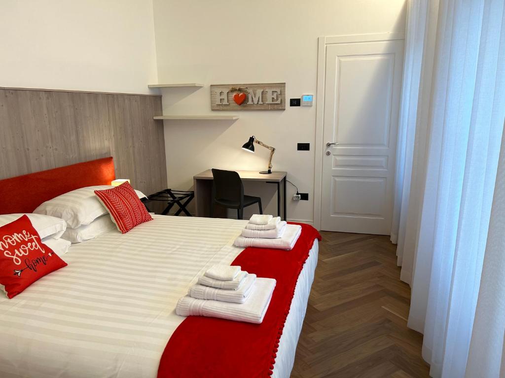 Łóżko lub łóżka w pokoju w obiekcie Casa Romano Suites
