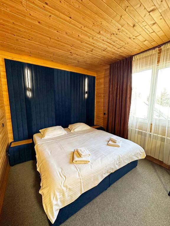 Postel nebo postele na pokoji v ubytování Wellland Hotel