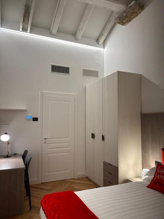 Łóżko lub łóżka w pokoju w obiekcie Casa Romano Suites
