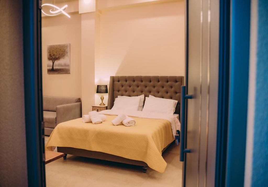 Ліжко або ліжка в номері Nicolas Luxury Suites