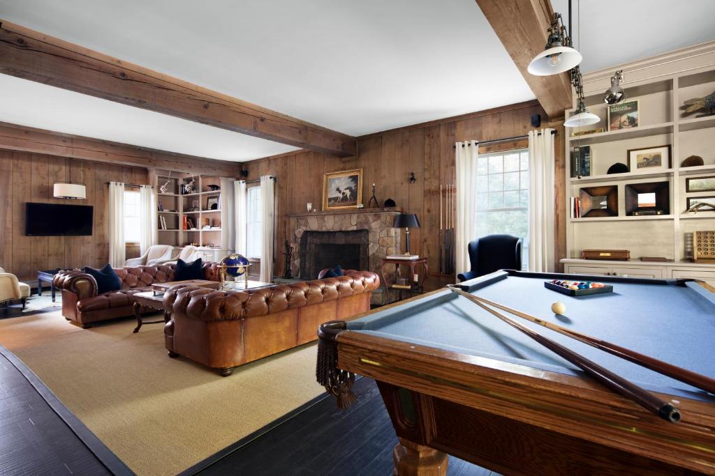 a living room with a pool table in it at Cape Arundel Inn - Club House in Kennebunkport
