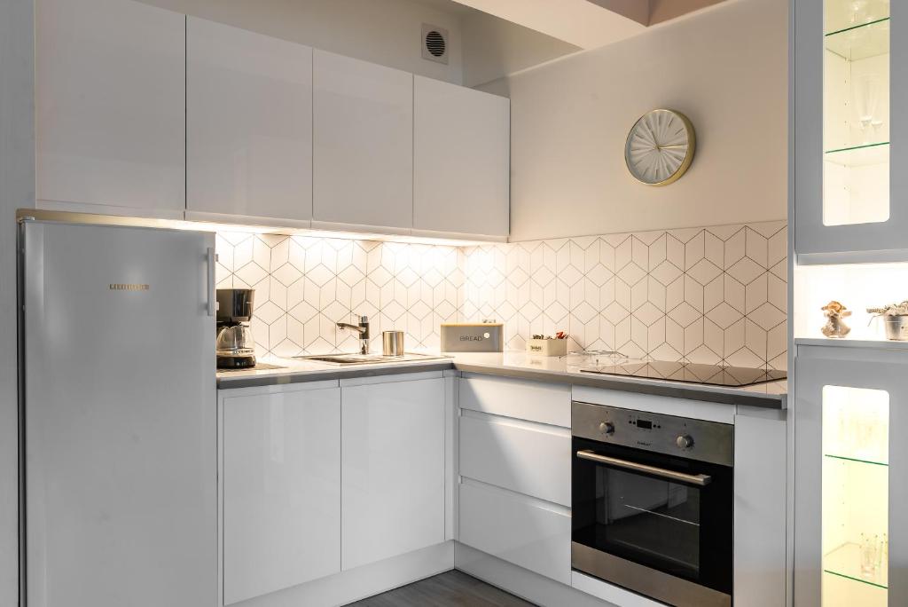 Kuchyňa alebo kuchynka v ubytovaní Apartamenty Orkana Centrum Zakopane