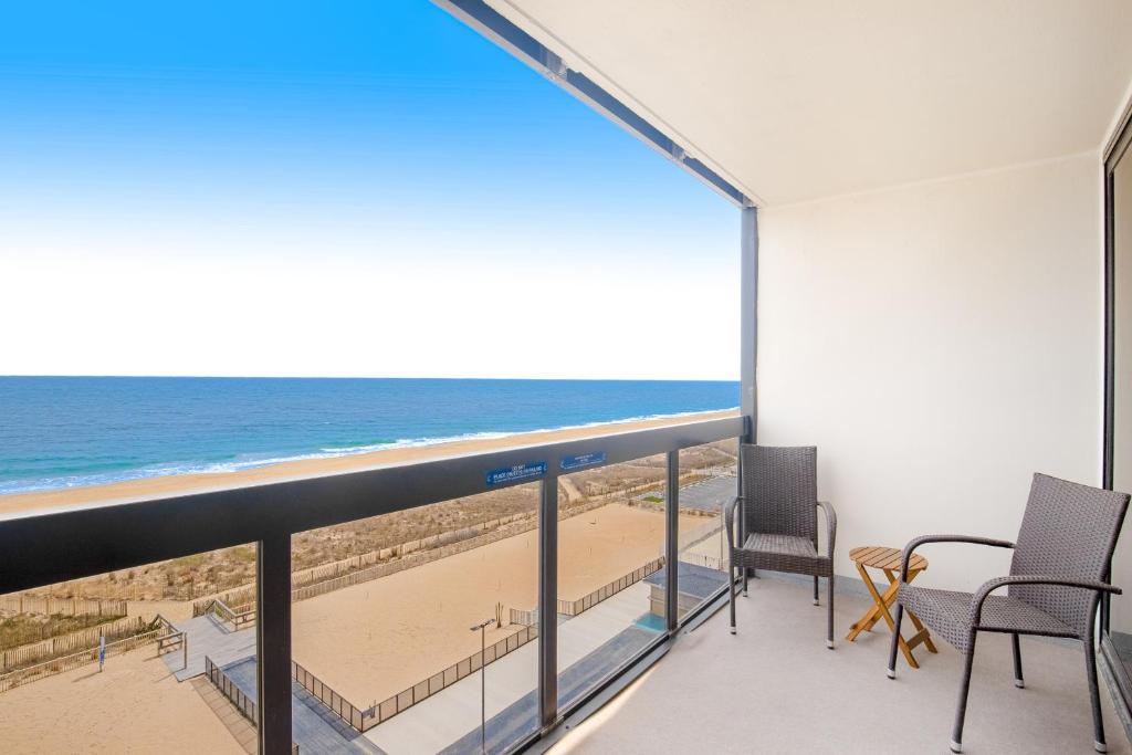 a balcony with a view of the beach at Golden Sands 607 in Ocean City