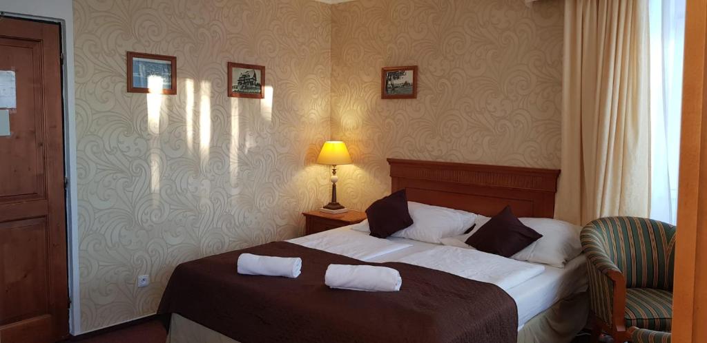 Postel nebo postele na pokoji v ubytování Hotel a restaurace Pomezí