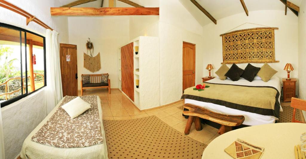 
A bed or beds in a room at Pikera Uri Eco Lodge
