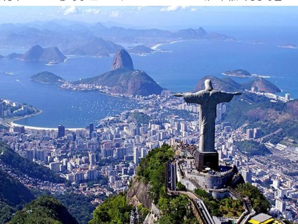 a view of the statue of christ redeemer on the mountain at Botafogo Guesthouse in Rio de Janeiro