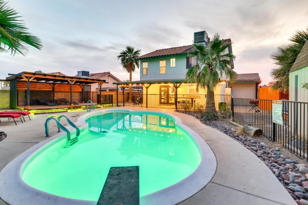 a swimming pool in the backyard of a house at Laughlin Retreat with Pool 2 Mi to Big Bend! in Laughlin