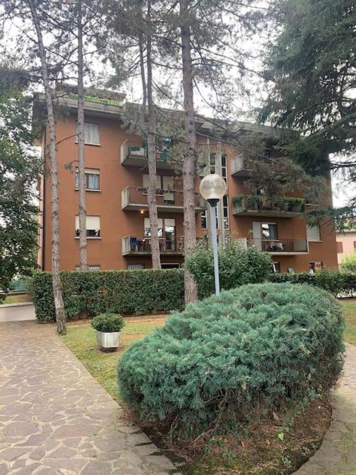 a building with a bush in front of a building at Appartamento brevi periodi "Pedrini's Welcome Home" in Bergamo