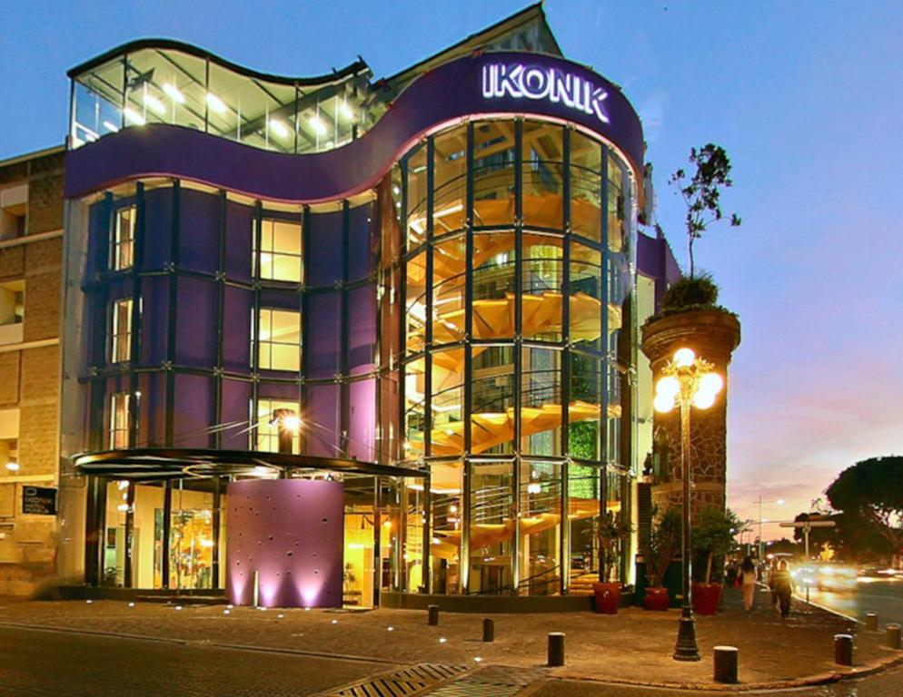 a large building with a sign on the side of it at Ikonik Hotel Puebla in Puebla