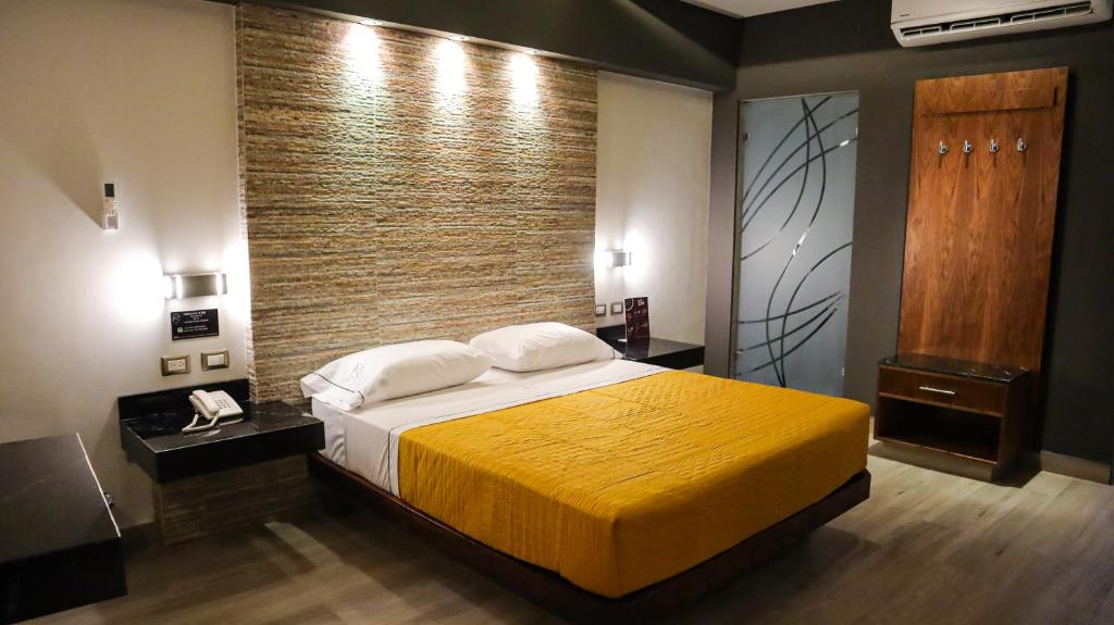 Postel nebo postele na pokoji v ubytování Hotel Myst.