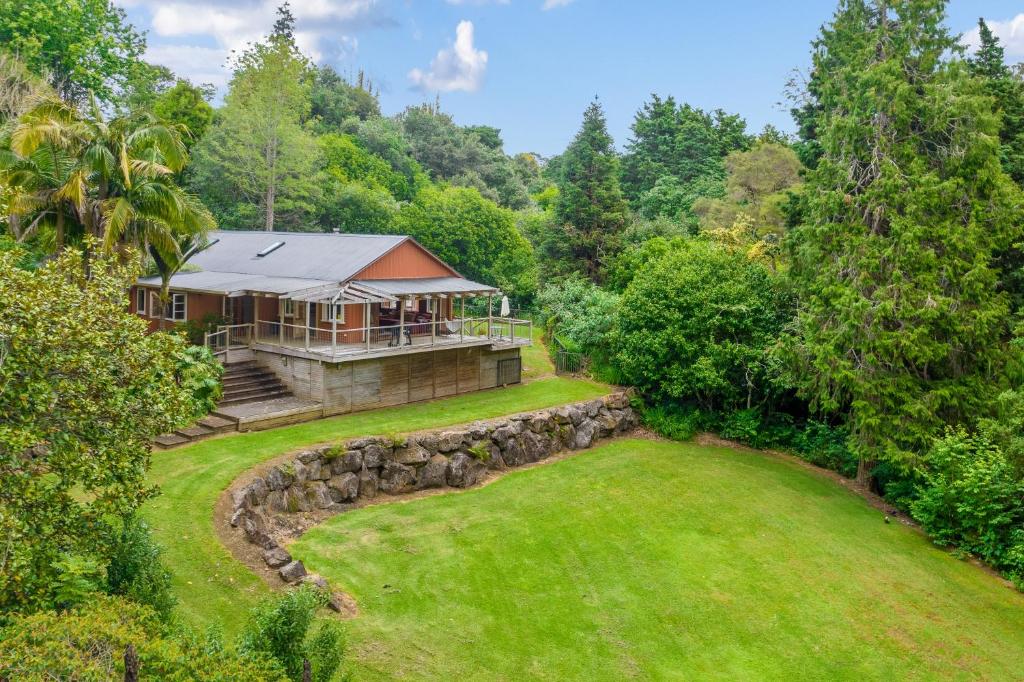 an aerial view of a house with a yard at Stillhaven - Kerikeri Riverside Retreat in Kerikeri