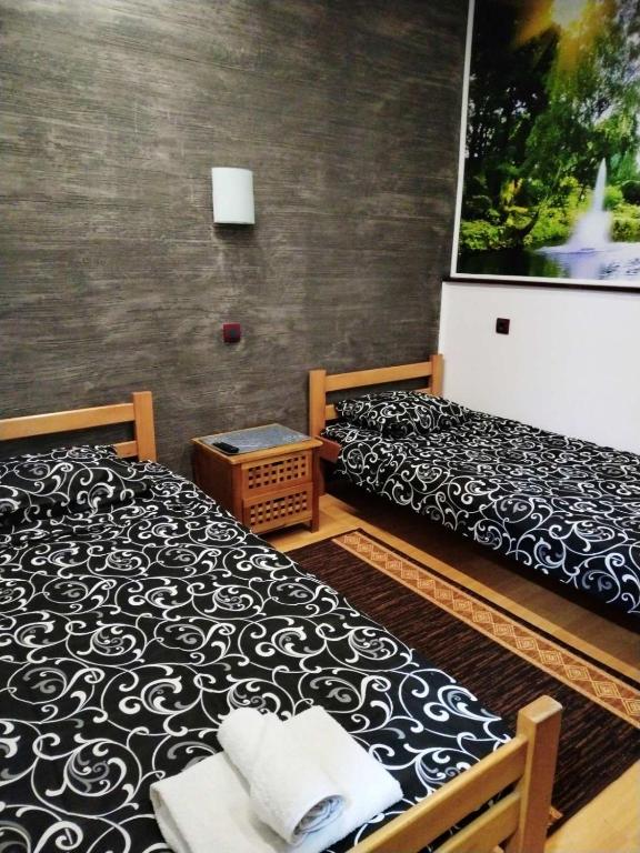 Postel nebo postele na pokoji v ubytování FUN ROOMS SOBE PRENOĆIŠTE