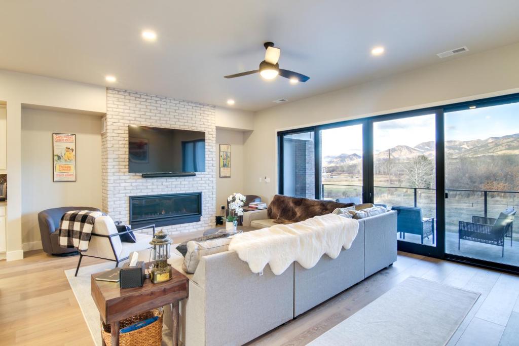 a living room with a couch and a fireplace at Modern Bozeman Escape with Bridger Mountain Views! in Bozeman