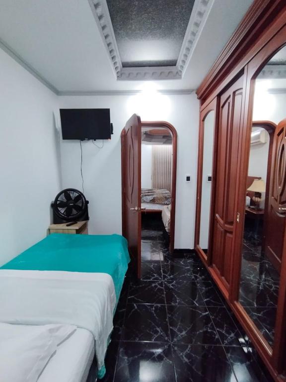 Postel nebo postele na pokoji v ubytování Hotel Miluansa