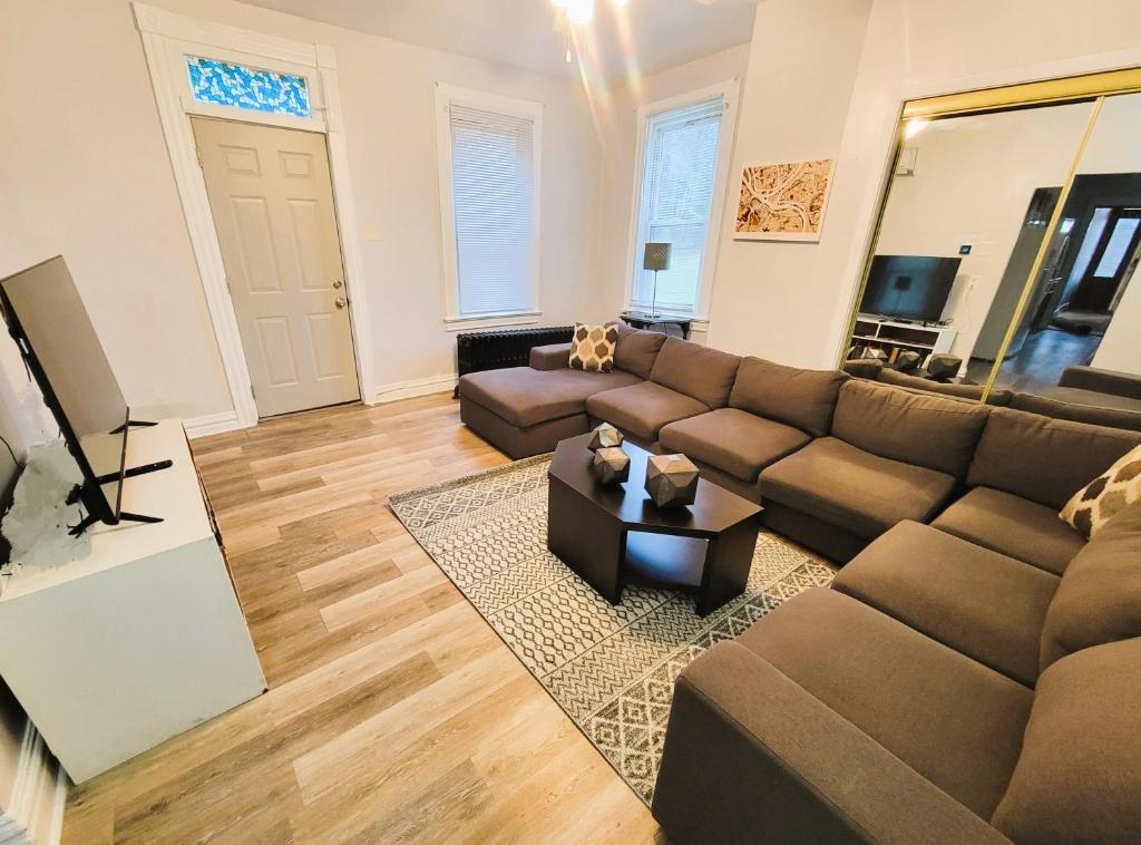 a living room with a couch and a coffee table at 2 BR - Off Street Parking - Amazing View Nearby in Pittsburgh