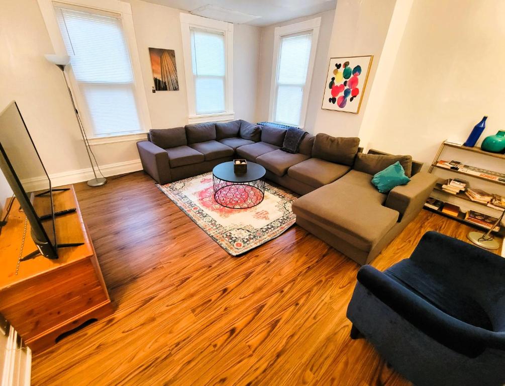 a living room with a couch and a table at 3 BR - Off Street Parking - Amazing View Nearby in Pittsburgh
