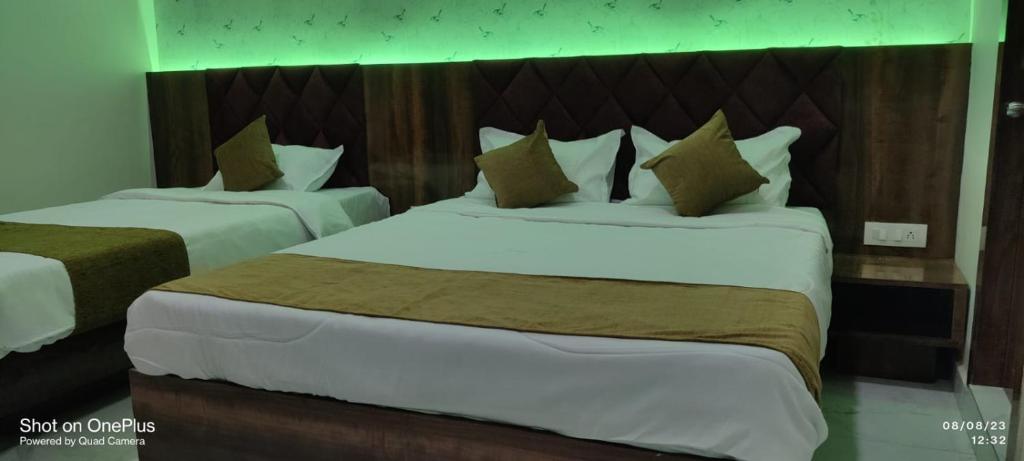 Postel nebo postele na pokoji v ubytování Hotel Praj Paradise