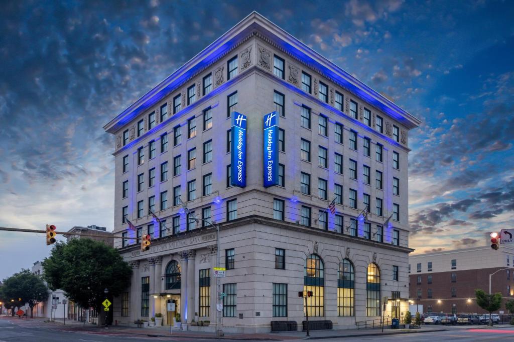 a white building with a blue sign on it at Holiday Inn Express Baltimore-Downtown, an IHG Hotel in Baltimore