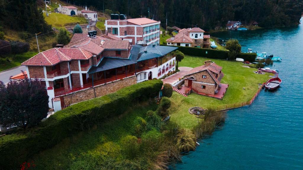 an aerial view of a house on an island in the water at Hotel Refugio Santa Ines in Aquitania