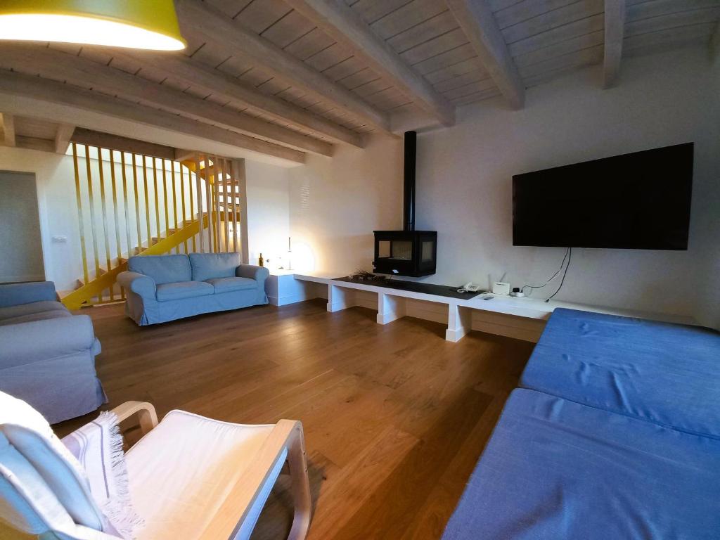 a living room with a flat screen tv and a couch at Casa L'Armentera, 3 dormitorios, 6 personas - ES-89-123 in Ventalló