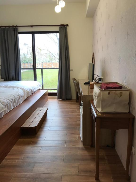 Postel nebo postele na pokoji v ubytování 花蓮太平洋會館民宿