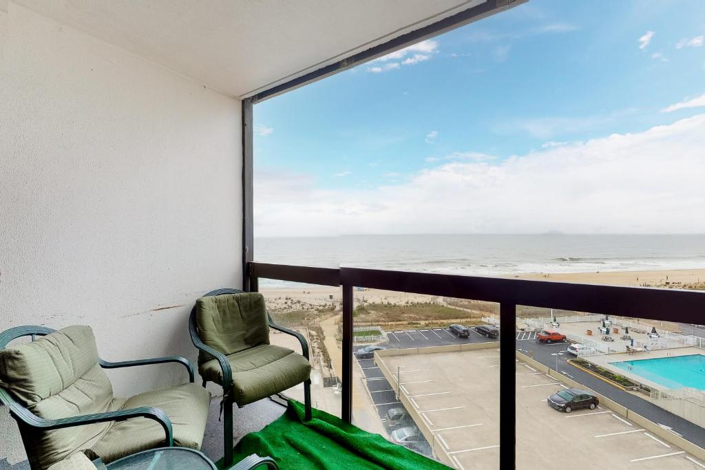 a balcony with chairs and a view of the beach at Golden Sands 618 in Ocean City