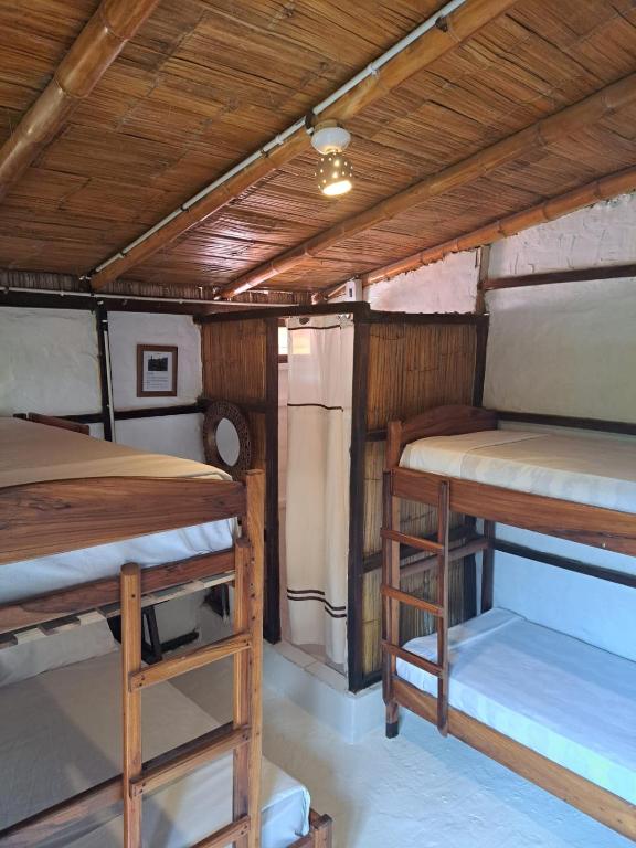 Postel nebo postele na pokoji v ubytování Hotel Gabarra Lodge