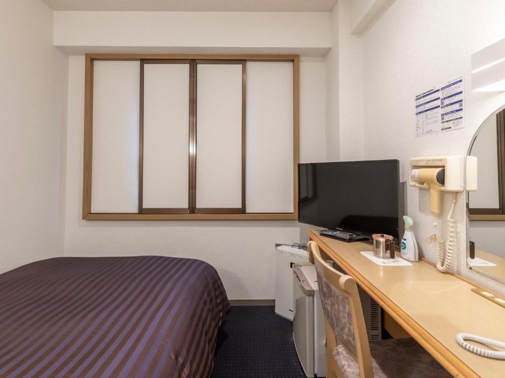 TV a/nebo společenská místnost v ubytování Hotel HORAIRE Saijo