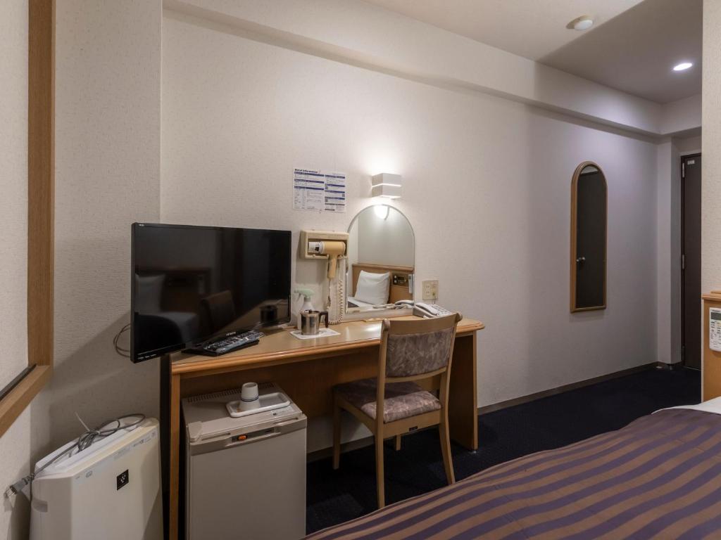 TV a/nebo společenská místnost v ubytování Hotel HORAIRE Saijo