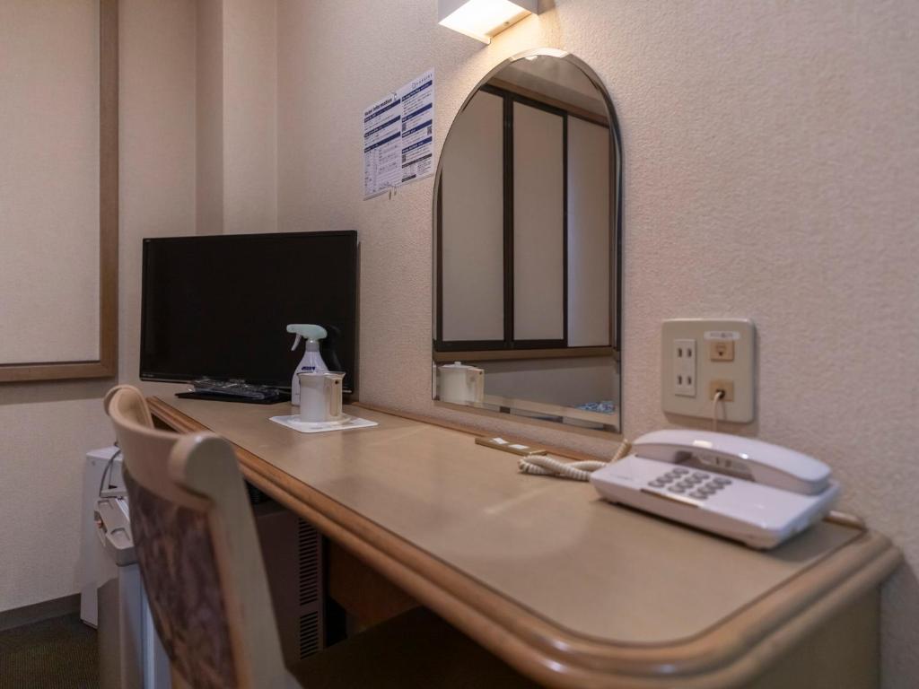 TV a/nebo společenská místnost v ubytování Hotel HORAIRE Saijo