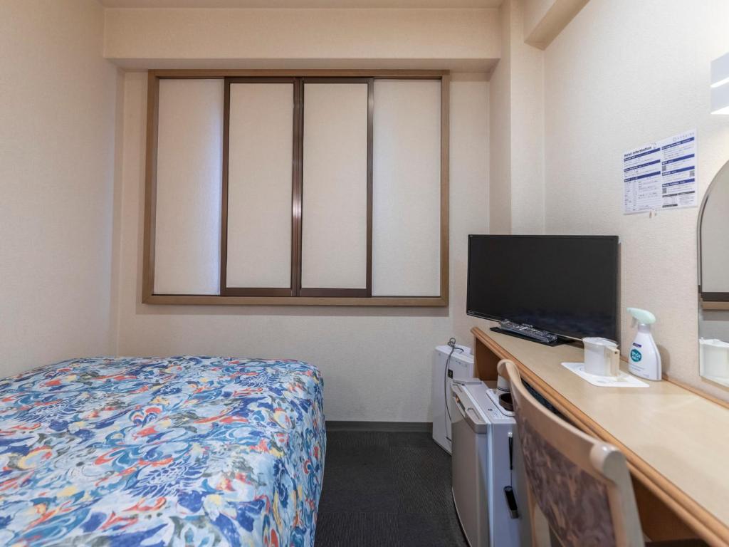 TV a/nebo společenská místnost v ubytování Hotel HORAIRE Saijo