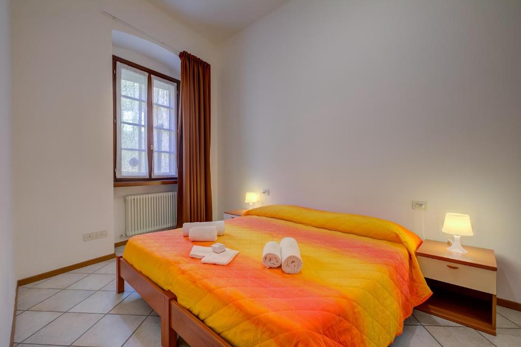 Łóżko lub łóżka w pokoju w obiekcie Casa Alpino