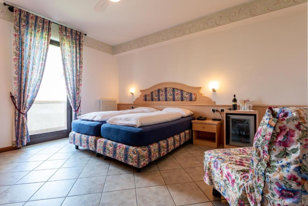 Postel nebo postele na pokoji v ubytování Hotel Alesi