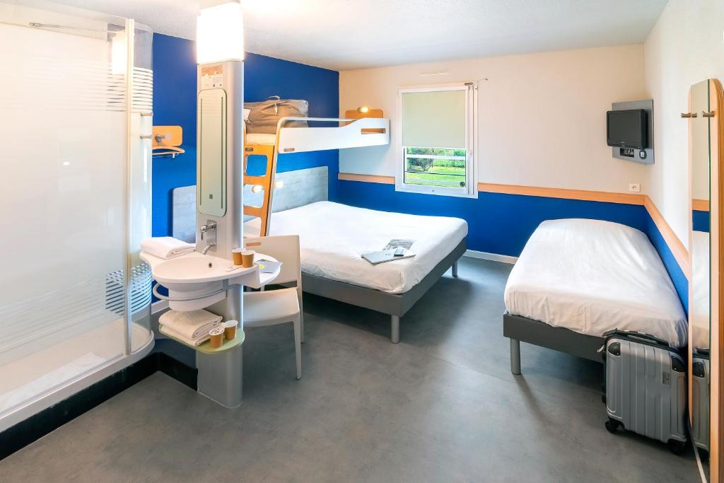 Postel nebo postele na pokoji v ubytování ibis budget Saint-Maximin