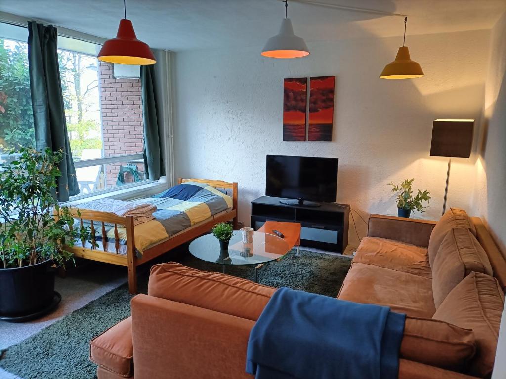 a living room with a couch and a table at Three bedroom apartment in Heerlen in Heerlen