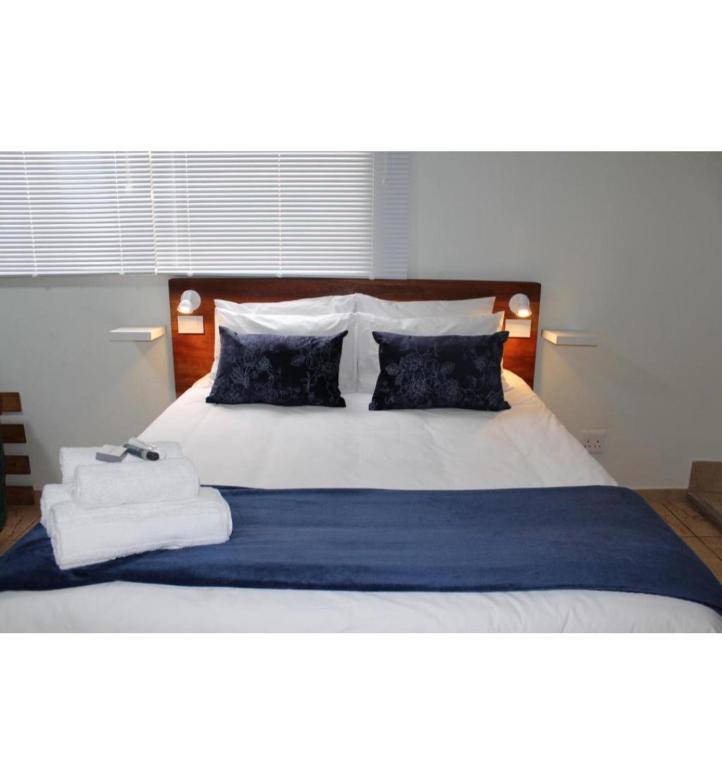 a bedroom with a bed with towels on it at Sunny Stay in Groblersdal
