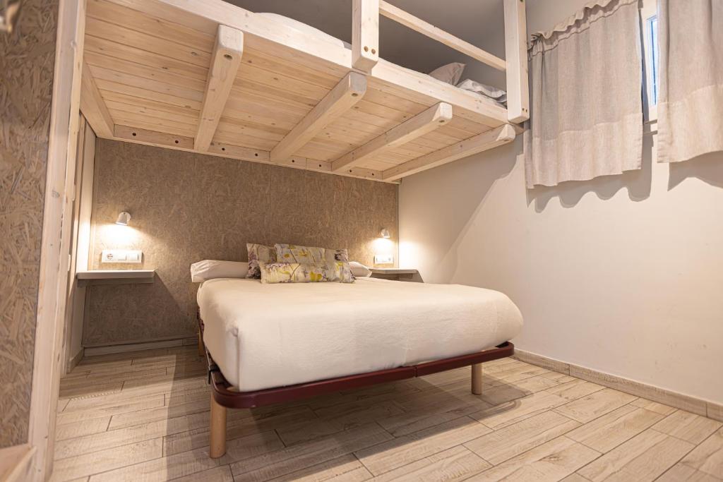 a bedroom with a large bed in a room at LUZ in Sierra Nevada