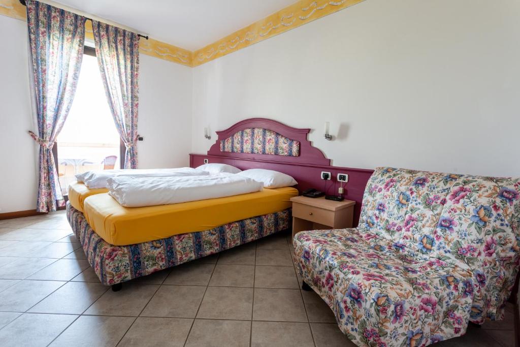 Postel nebo postele na pokoji v ubytování Hotel Alesi