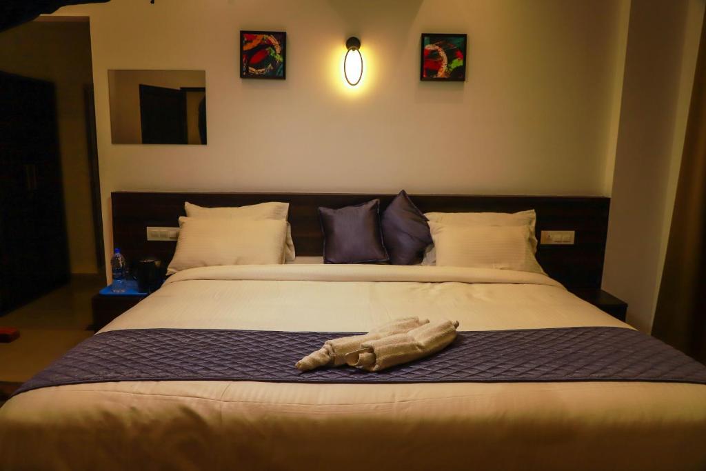 Postel nebo postele na pokoji v ubytování Konfudha Resort