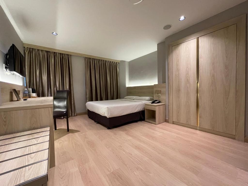 Postel nebo postele na pokoji v ubytování Hotel Imperial