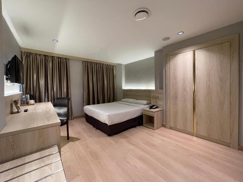 Postel nebo postele na pokoji v ubytování Hotel Imperial