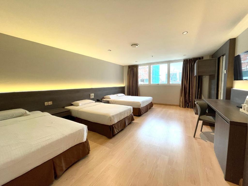 Postel nebo postele na pokoji v ubytování Hotel Imperial