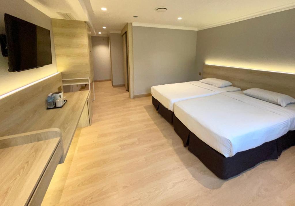 Postel nebo postele na pokoji v ubytování Hotel Imperial
