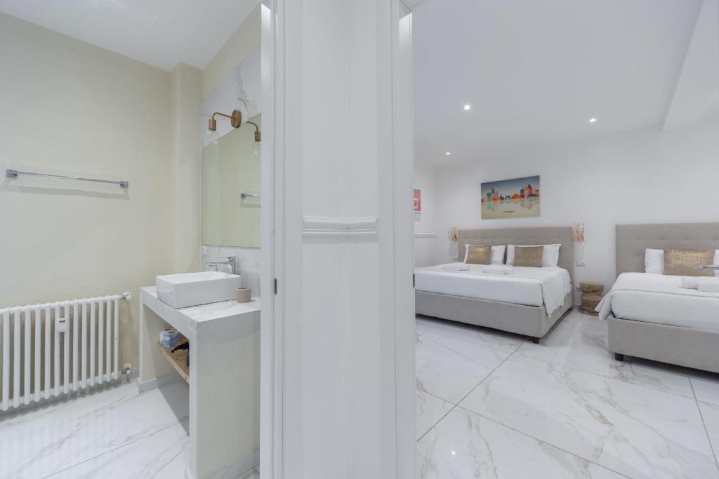 Postel nebo postele na pokoji v ubytování Leia Hospitality