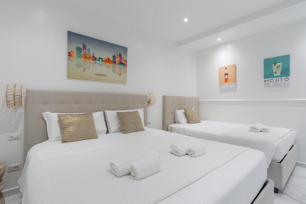 Postel nebo postele na pokoji v ubytování Leia Hospitality