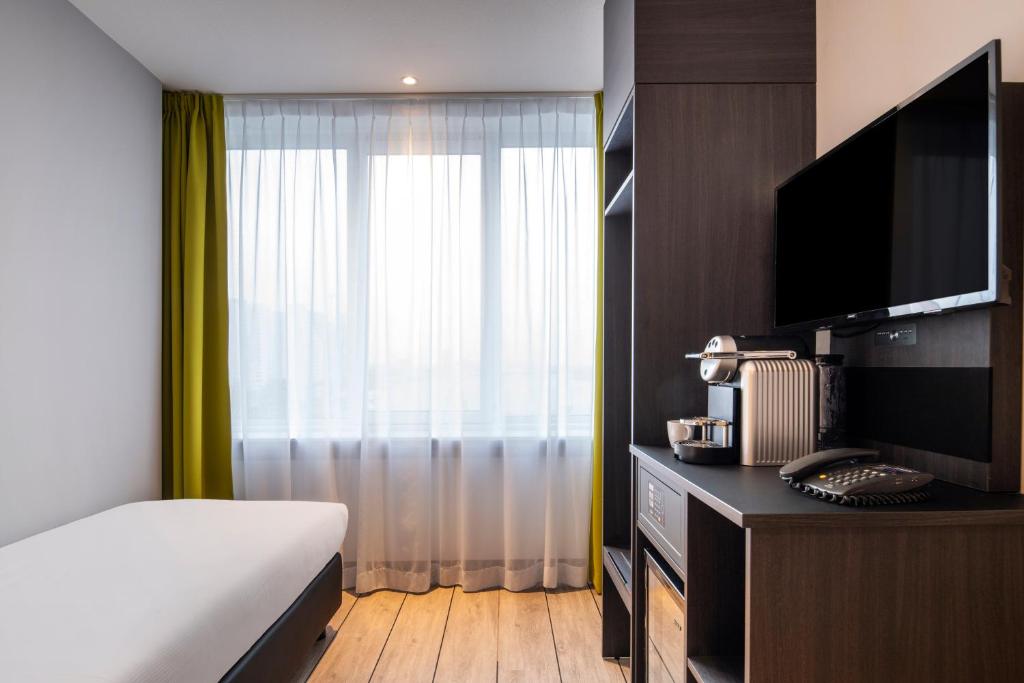 Postel nebo postele na pokoji v ubytování Thon Hotel Rotterdam City Centre