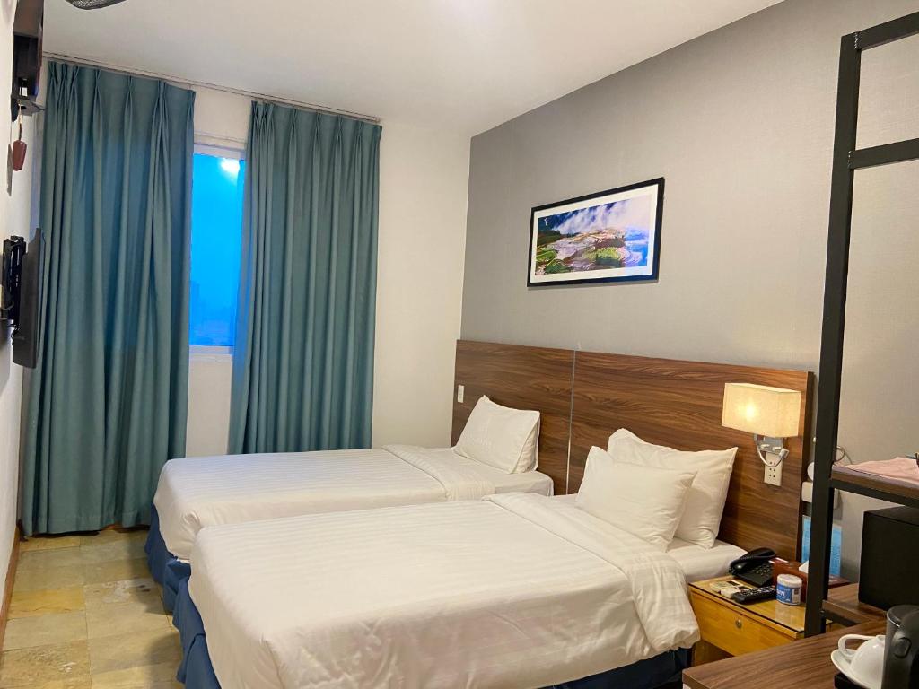 Postel nebo postele na pokoji v ubytování A25 Hotel - 12 Ngô Sỹ Liên