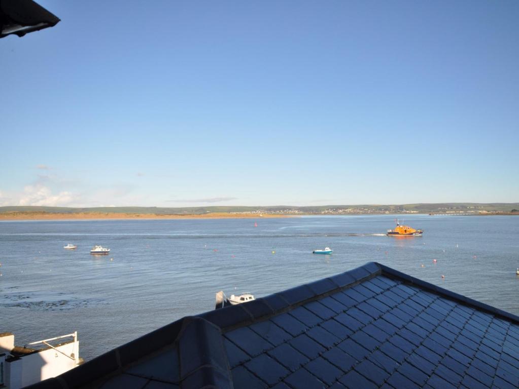 a view of a large body of water with boats at 1 Bed in Appledore MASTR in Appledore